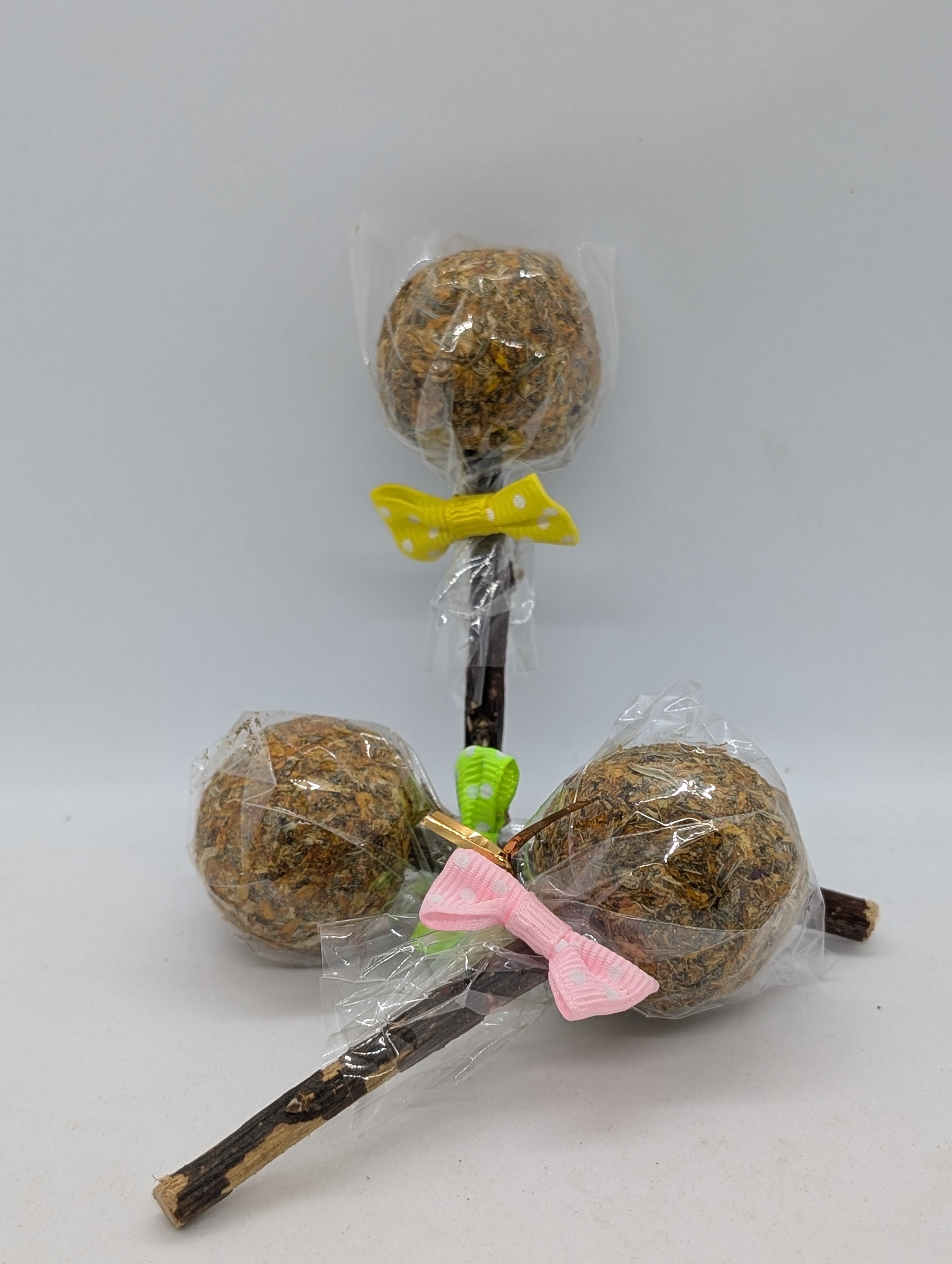 Fun lollipop treats made from hay, herbs, and apple branches for rabbits, guinea pigs, chinchillas, and other pet rodents